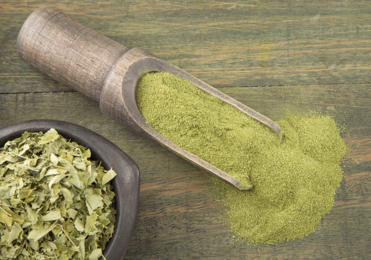 This image showcases kava in both powdered and dried leaf forms, commonly used to prepare a traditional kava drink